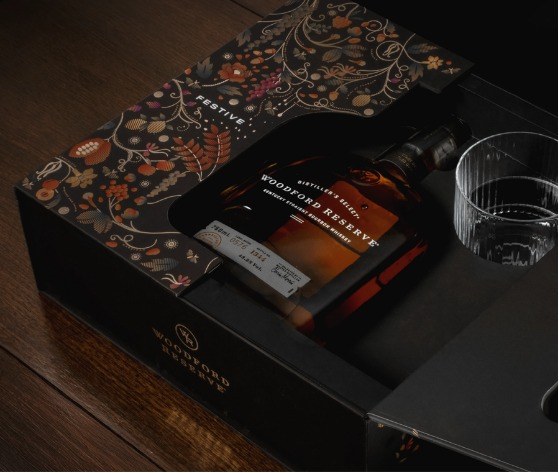 Woodford Reserve gift box opened, showing bottle and rocks glass inserts
